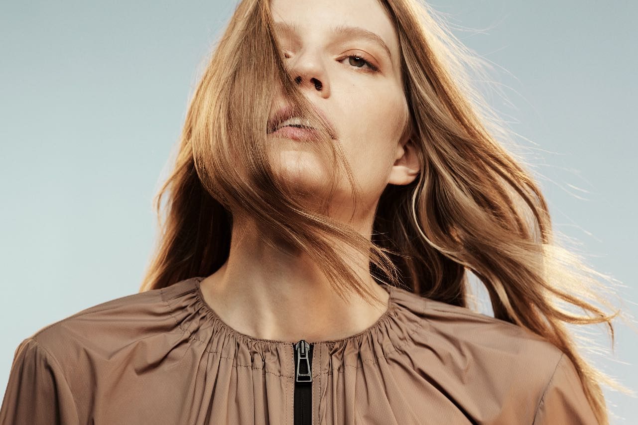Hair across the face, wind