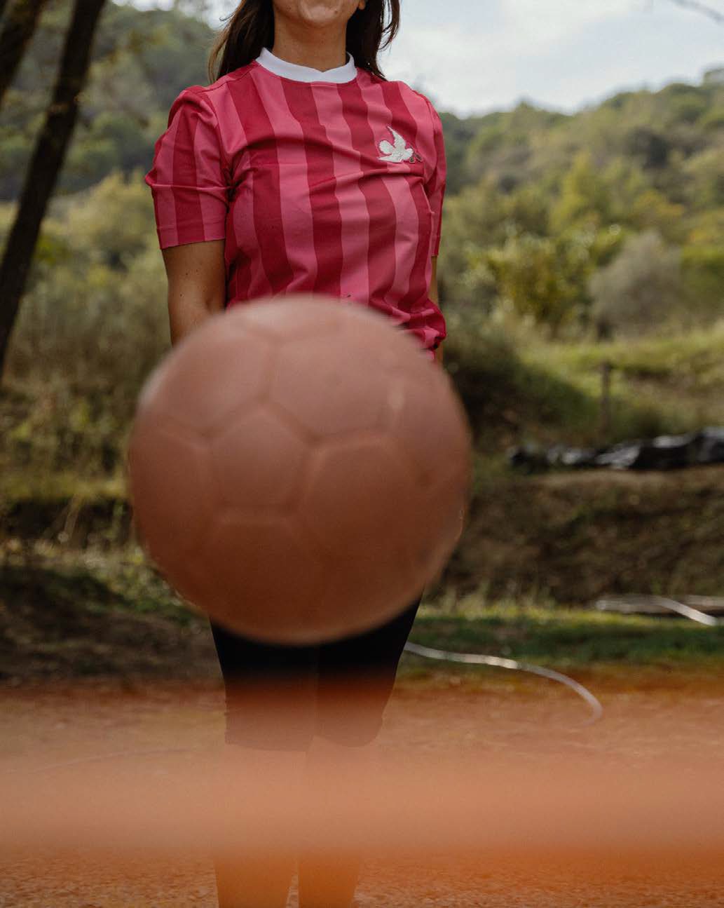 Player holding a ball to the camera
