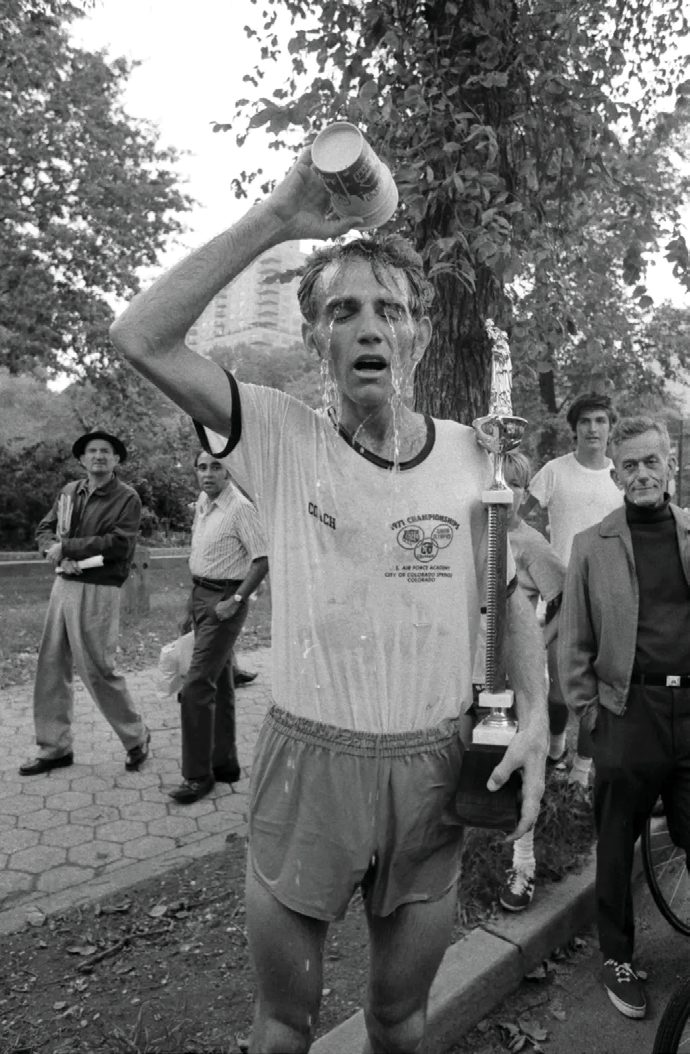 Runner pouring water over his head