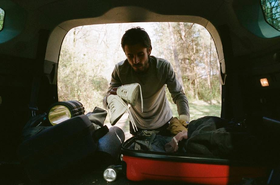 Sitting in the boot of a car