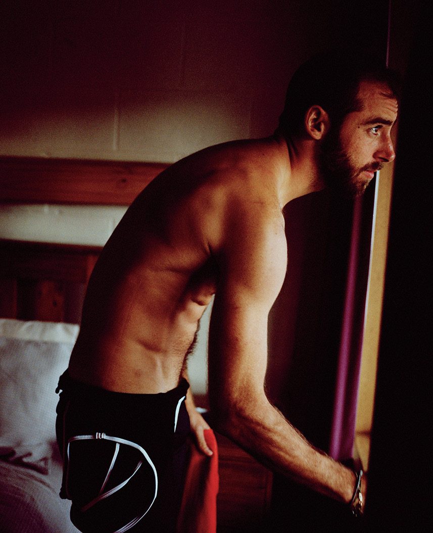 Athlete stretching in a doorway