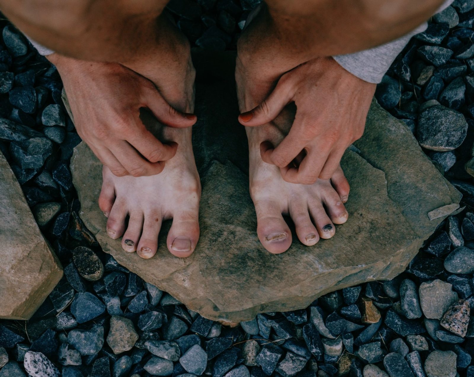 Bare feet on stones