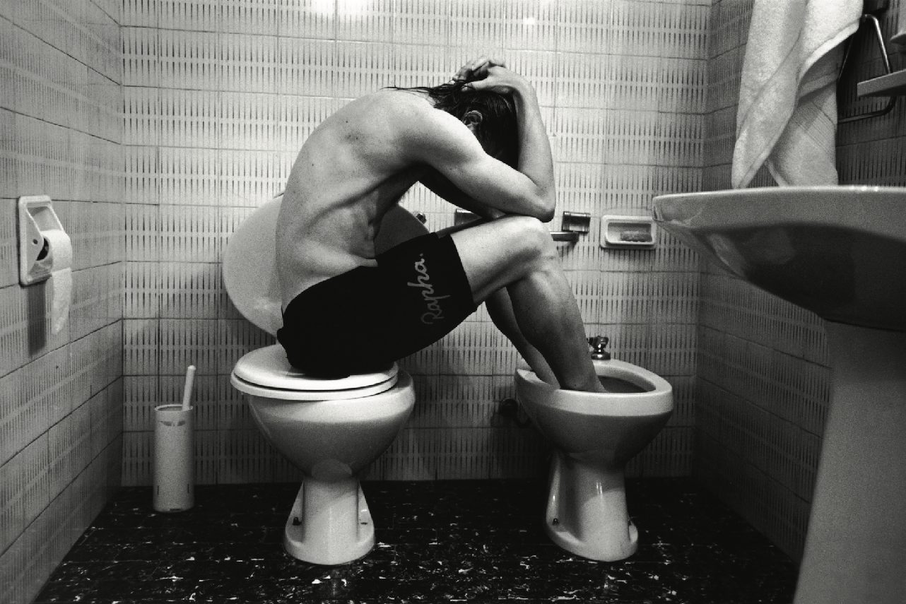 Riders in a roadside washroom