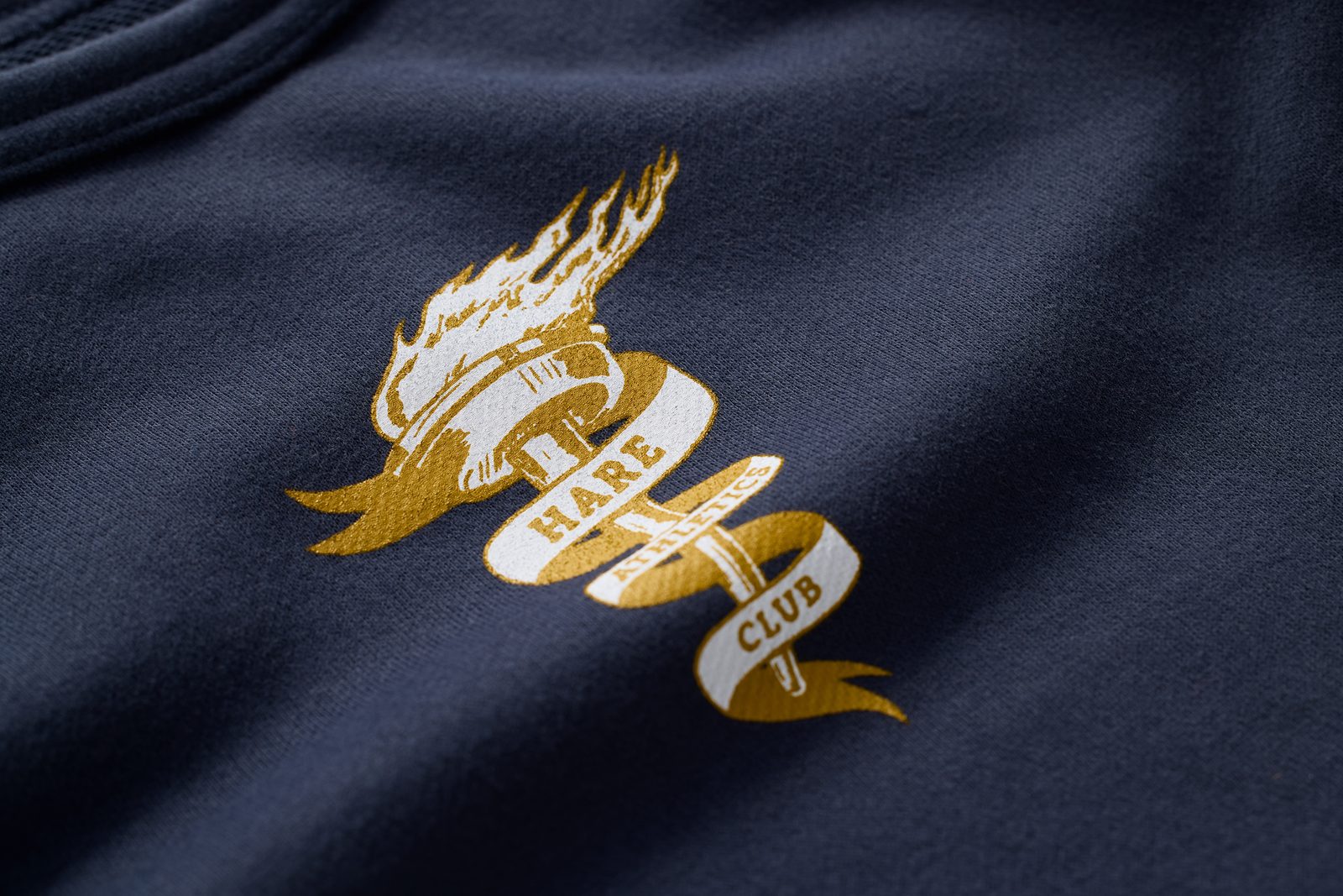 Gold hare emblem embroidered on navy