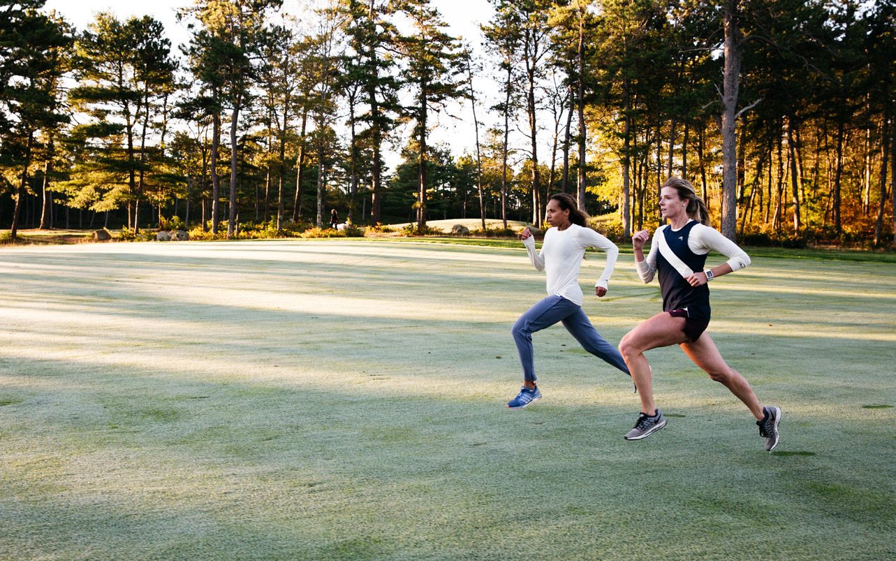 Runners crossing a field